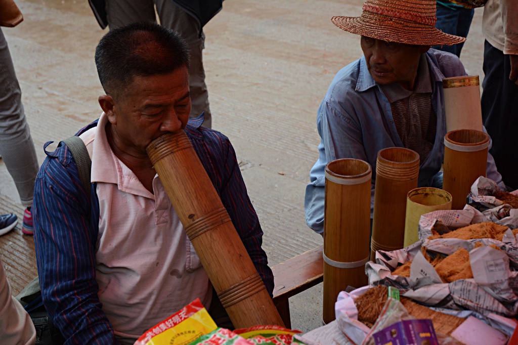 Testing tobacco at the Laomeng market