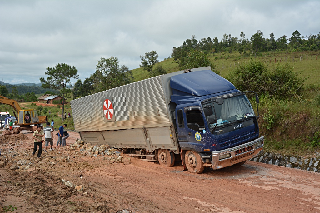 Bad luck: While the truck remained stuck in the mud, the makeshift road is taking shape